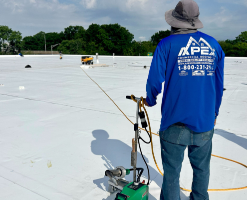 Apex Roofer Back To Camera On White Roof