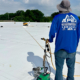 Apex Roofer Back To Camera On White Roof