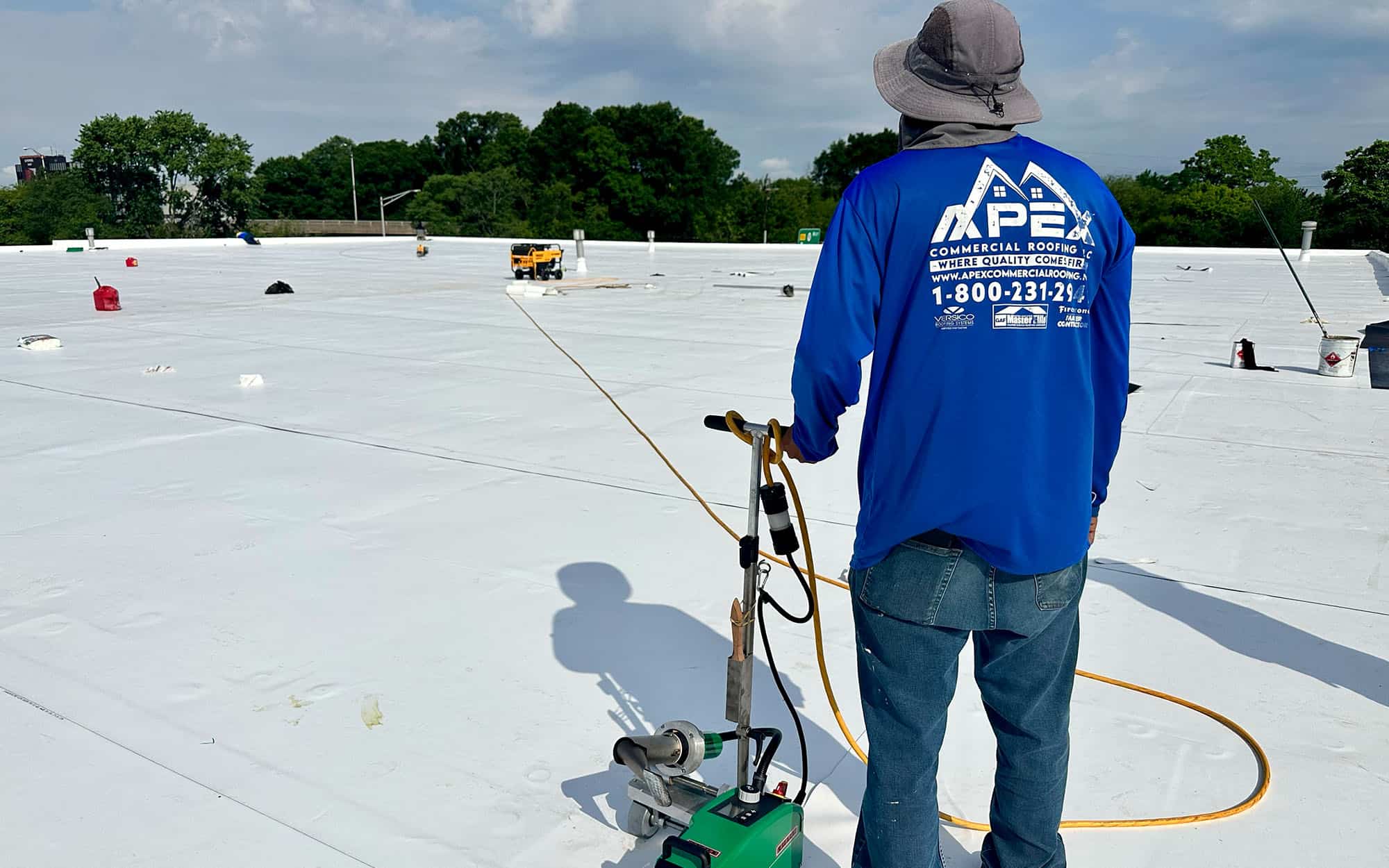 Apex Roofer Back To Camera On White Roof