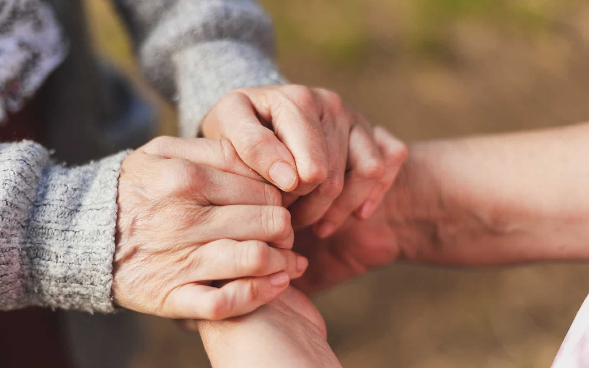 Niece Holding Granny's Hands