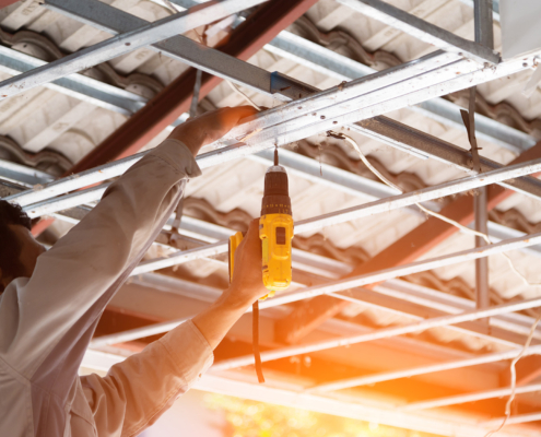 Worker Replacing Commercial Roof